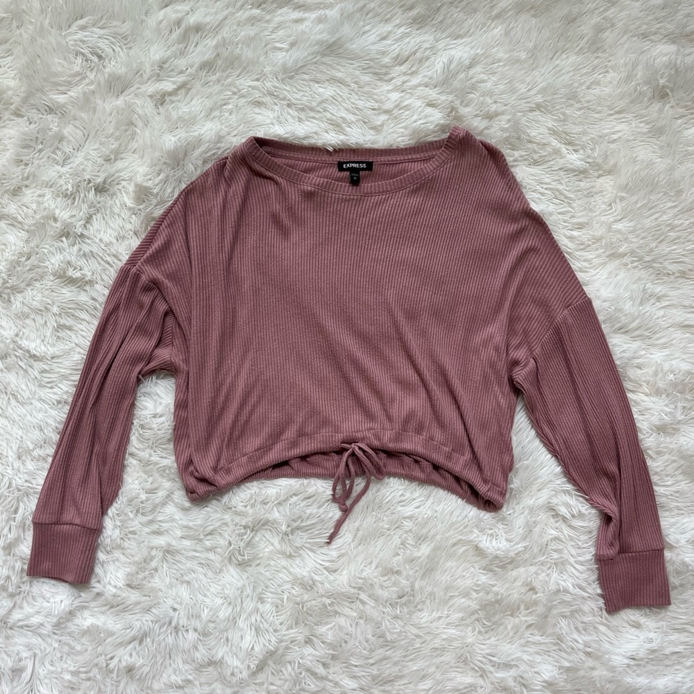 Express light pink top with adjustable string for customized wear.